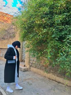 a person standing in front of a tree