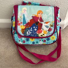 Nee Disney Frozen Lunch Bag Disney School Bag With Adjustable Strap, Disney Style Rectangular Shoulder Bag For School, Disney Shoulder Bag For School With Adjustable Strap, Blue Rectangular Bag For Disney Trips, Disney School Bags In Rectangular Shape, Playful Pink Bag For Disney Trips, Disney Aprons, Ballerina Book, Tinkerbell Disney