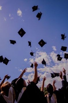 graduates throwing their caps in the air