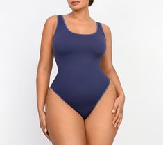 Featuring a low-back design that pairs perfectly with backless dresses, this smoothing bodysuit also features chest support and smoothing at the tummy to provide a lifted and flattering appearance. From Shapellx. High Stretch Smoothing One-piece Bodysuit, One-piece Second-skin Smoothing Bodysuit, Smoothing Second-skin One-piece Bodysuit, Solid One-piece Smoothing Leotard, Smoothing One-piece Leotard, Backless Second-skin Smoothing Shapewear, Smoothing Scoop Neck Shapewear Bodysuit, Shapewear Bodysuit With Low Back, Solid Color Smoothing Shapewear Bodysuit