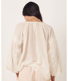 Elegant and sweet, our Magnolia Blouse features intricate details of micro ruffles, lace trims and tassels all crafted on the softest organic cotton. Pair this back with your favourite denim or dress it up with a statement skirt and jewels to take this baby from day to night. Crafted from our preferred fibre 100% organic cotton Shell buttons down front allowing it to be worn as a blouse or open as a shirt Unlined for easy wear 100% Organic Cotton Elasticated Sleeve Cuff Neck Ties Raglan Sleeve P