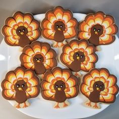 there are many turkey cookies on the plate