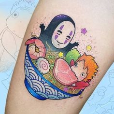 a person with a tattoo on their leg that has an image of a cartoon character in it