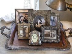 a tray with pictures and a lamp on it