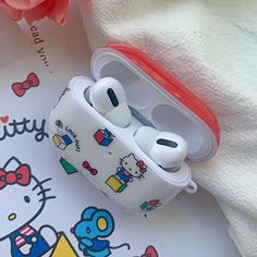 hello kitty airpods case sitting on top of a towel