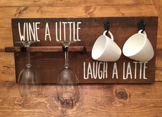 three wine glasses hanging on a wall with the words wine a little laugh laugh laugh laugh laugh laugh laugh laugh laugh laugh laugh laugh laugh laugh laugh laugh