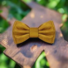 Sophisticated Yellow Bow Tie Choose your favorite shade of yellow bow tie! This bow tie is available as a self tie bow tie or a pre tied bow tie. Choose From: Single Bow Tie Bow Tie, Pocket Square Material of Bow Tie and Pocket Square: 100% Silk Bow Tie Fits Neck Sizes: 14 - 22” Inches Choose From: Self Tie Pre Tied Pattern On Fabric: Solid With Lined Perfection Color Of Fabric: Dandelion Yellow Golden Amber Tuscany Yellow Metallic Wheat Yellow Fitted Bow Tie For Formal Occasions, Yellow Bow, Yellow Fitted Tie-side Swimwear, Yellow Summer Ties, Yellow Bow Tie, Dandelion Yellow, Golden Amber, Tie Pattern, Silk Bow Ties