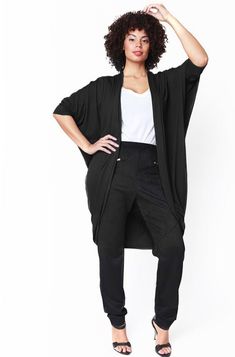 Mia Cocoon Cardigan is one of the Shegul’s timeless essential. Designed from luxurious heavy jersey knit is soft and comfy. Generous fit and fluid drape make it an ideal layering piece. Unique rounded hem to collar finish makes it a perfect grab for all seasons. Lounge to work seamless transition. Try yours over stylish Shegul tee and latest bottoms. Styled with Katia Wide belt Petites----->Chose Size S regardless of your sizeTalls-------->Chose Size L Heavy cut & sew sweater knit 95% Viscose 5% Cozy Black Relaxed Fit Cardigan, Relaxed Fit Black Knit Cardigan, Black Stretch Soft Knit Cardigan, Black Relaxed Fit Knit Cardigan, Black Stretch Open Knit Cardigan, Cocoon Cardigan, Seamless Transition, Wide Belt, Black Cardigan