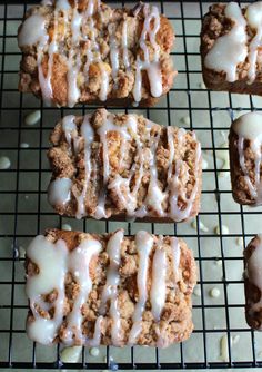 several pieces of bread with icing on a cooling rack