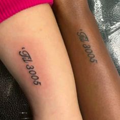 two people with matching tattoos on their arms, one has the same tattoo as the other