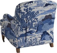 a blue and white chair with trees on it