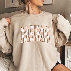 Varsity Mama Sweatshirt, Retro Checkered Mama Sweatshirt, Trendy Crewneck, Mothers Day Gift, Mom Life Shirt, Boujee Mama, New Mom Gift Thank you so much for taking the time to browse my shop. Please feel free to reach out if you have any questions before or after purchasing.  💖 🎨Warning: On products with a print chart in the listing, metallic print colors are printed as matte. We design and cut each graphic out with a soft touch, use matte vinyl and a heat press. The result will last for many Trendy Crewneck, Sweatshirt Trendy, Mom Life Shirt, New Mom Gift, Metallic Prints, Mama Sweatshirt, Oversized Style, New Mom, Gifts For New Moms