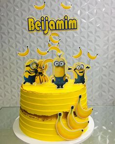 a yellow cake with minion and bananas on top that says beljaminin