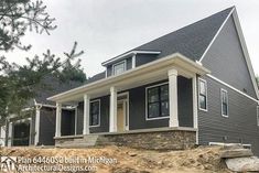 a house that is being built on the side of a hill