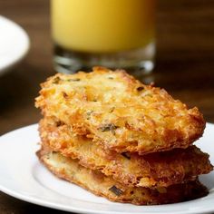 two pieces of fried food on a white plate