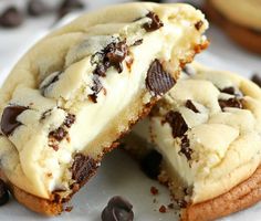 an oreo cookie with chocolate chips and ice cream on top is cut in half