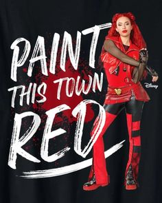 a woman with red hair and black pants is wearing a t - shirt that says paint this town red