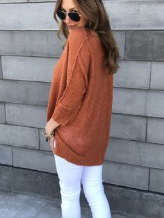 Our Ocean View Sweater is so adorable and easy to wear in a luxe fine thread fabrication that's relaxed in fit! The exposed seamed detailing gives it a raw finish for the perfect touch. Featuring a wide v-neckline that could easily slip off one shoulder, high low hem, ribbed trim, 3/4 sleeves and a slouch silhouette. Lightweight, soft knit.Stylist Tips:♥︎ Wear with white distressed skinnies for the ultimate warm weather casual look. ♥︎ Pair with jeans shorts and lace up sandals. Add a Panama Hat Stretch Sweater For Everyday In Fall, Stretch Sweater For Everyday Fall Wear, Plain Tops For Layering In Fall, Slouchy Solid Color Top For Fall, Solid Color Slouchy Top For Fall, Slouchy Top For Fall, Cozy Solid Color Tops For Spring, Fall Season Solid Color Relaxed Fit Sweater, Soft Knit Tops For Fall Day Out