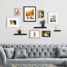 a living room filled with furniture and framed pictures on the wall above it's coffee table