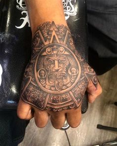 a person with a tattoo on their hand