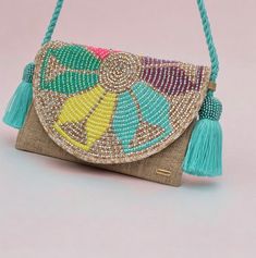 🌸 GIORGA, Handmade with Heart 🌸 This handmade Wayuu Colombian bag is the perfect Clutch bag for anyone on the go. It's a traditional Crochet Purse that is handmade with love.  DETAILS:  ✨ All of our products are 100% handmade, we not only produce the most traditional Wayuu bags but also unique designs to highlight and enrich any look, versatility and tradition hand in hand.  ✨ This base is woven in 100% cotton crochet thread, with a fringed strap to match the base and closes with a cord that ends with a woven leaf, a stamp of our brand.  ✨ On this Wayuu base, a distinctive piece of our country, the embroidery process begins, a mixture of embroidery, stones and pearls.  ✨Our bags are unique pieces, we always work so that the result of the work is an authentic product.  ✨ Its weaving time Traditional Multicolor Bag With Fringe, Traditional Multicolor Fringe Bag, Embroidery Stones, Sewing Upcycling, Colorful Clutch, Bags Ideas, Upcycle Sewing, Purse Handmade, Wayuu Bag