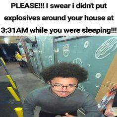 a man with an afro is sitting in front of a sign that says please i swear i didn't put explosives around your house at 3 31 am while you were sleeping