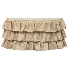 the ruffled table skirt is shown in beige