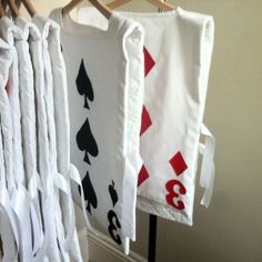 some cards are hanging on the clothes rack