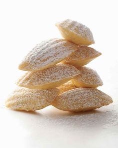 powdered sugar cookies stacked on top of each other in the shape of a pyramid