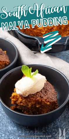 three small black bowls filled with food on top of a blue tablecloth and white napkin