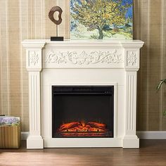 a white fireplace with a painting on the wall