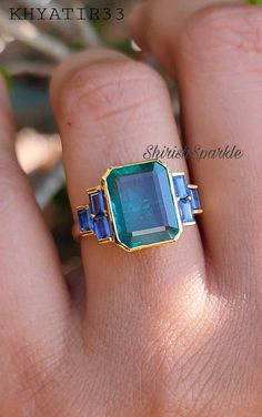 Blue Gem Engagement Ring, Emerald Rings Engagement, Emerald Cut Emerald Engagement Ring, Emerald And Sapphire Ring, Wedding Ring With Emerald, Emerald Green Engagement Ring, Emerald Cut Emerald Ring, Emerald Ring Design, Engagement Rings Natural