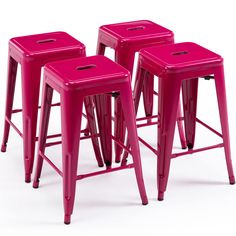 three pink metal stools sitting next to each other