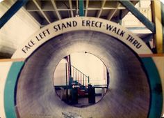 there is a large pipe in the middle of a building that says, facc left stand erect - walk thru