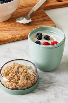 a bowl of granola with yogurt and berries