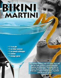 a woman standing next to a blue martini