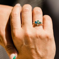 a woman's hand with a ring on it