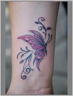 a small butterfly tattoo on the wrist and foot, with swirls around it's wings