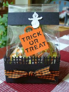 a trick or treat in a box with a sign on it