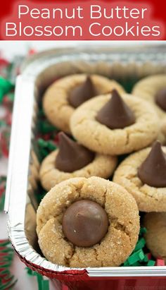 peanut butter blossom cookies in a tin with chocolate