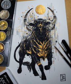 a drawing of a bull with gold paint on it's face next to some coins