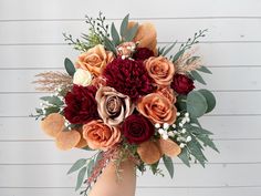 a bouquet of flowers in a vase on a table