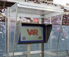 a sign in front of a large crowd at a sporting event with the words vr on it