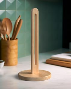 a wooden utensil holder on a kitchen counter