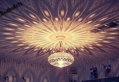 a chandelier hanging from the ceiling in a room