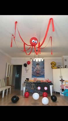 an octopus themed party with balloons and streamers