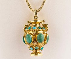 "This very unique and handmade Vintage 18k Yellow Gold Turquoise Urn Pendent hangs beautifully from a 14K yellow gold woven chain. When buying a handmade piece of jewelry you are sure to get a one of a kind piece. This will make a statement on the neck and be a wonderful addition to your jewelry wardrobe. 18k Yellow Gold handmade Urn Pendant 6 oval cut Turquoise Stones 17 round cut turquoise stones Pendant is 1 3/4\" inches long including bale Chain is 14k Yellow gold with a woven design and is Antique Turquoise Jewelry, Etruscan Jewelry, Single Pearl Pendant, Art Deco Locket, Antique Wedding Bands, Antique Turquoise, Urn Pendant, Historical Jewellery, Vintage Jewelry Art