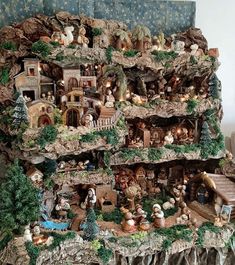 a christmas display with many figurines in it