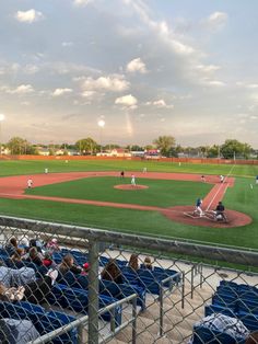 a baseball game in progress with the batter up to plate