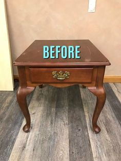 a small wooden table with the word before painted on it's top and bottom